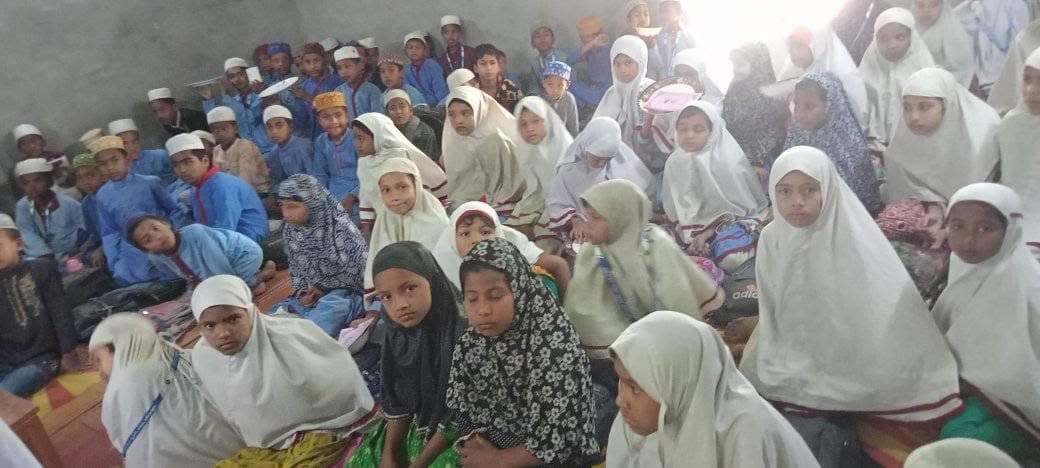 Rows of students watching the classroom prize giving