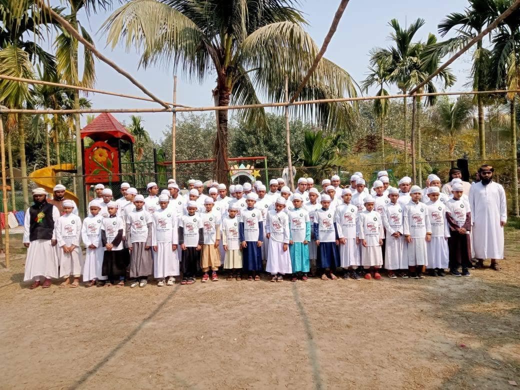 Group photograph beside the playground during the study tour