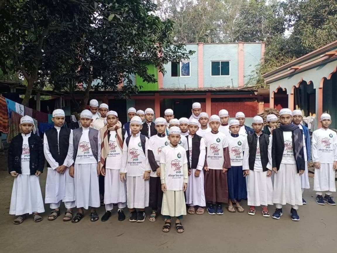 Madrasa students gathered outside a building on the study tour
